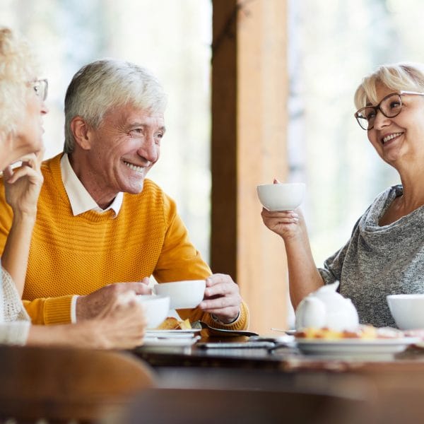 Group of friends talking over a cup of tea.