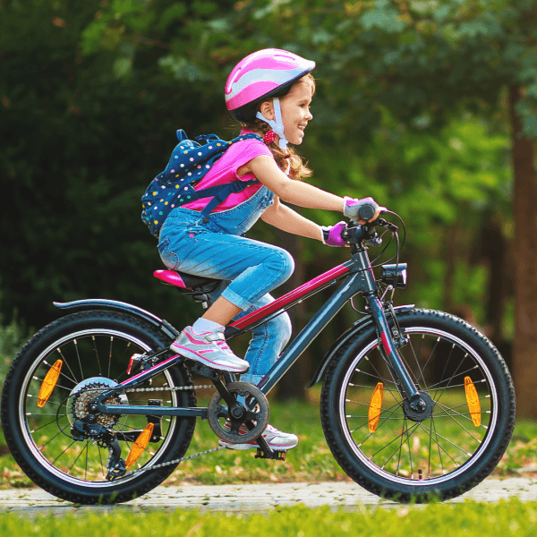 A girl riding a bike.
