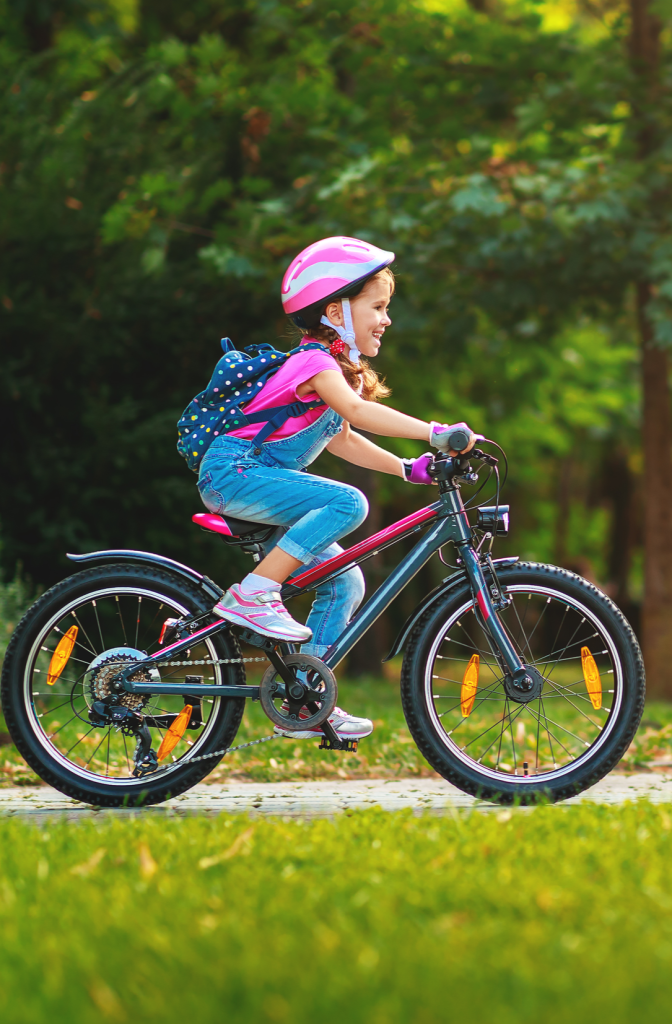 A girl riding a bike.